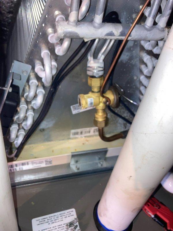 Performed preventative maintenance agreement visit on air conditioning system. Upon inspection, discovered significant ice buildup on refrigerant lines and evaporator coil, indicating restricted airflow or low refrigerant charge. Removed and inspected blower wheel assembly, which showed normal operational wear. System requires further diagnostic evaluation to determine root cause of icing condition and restore proper cooling operation.