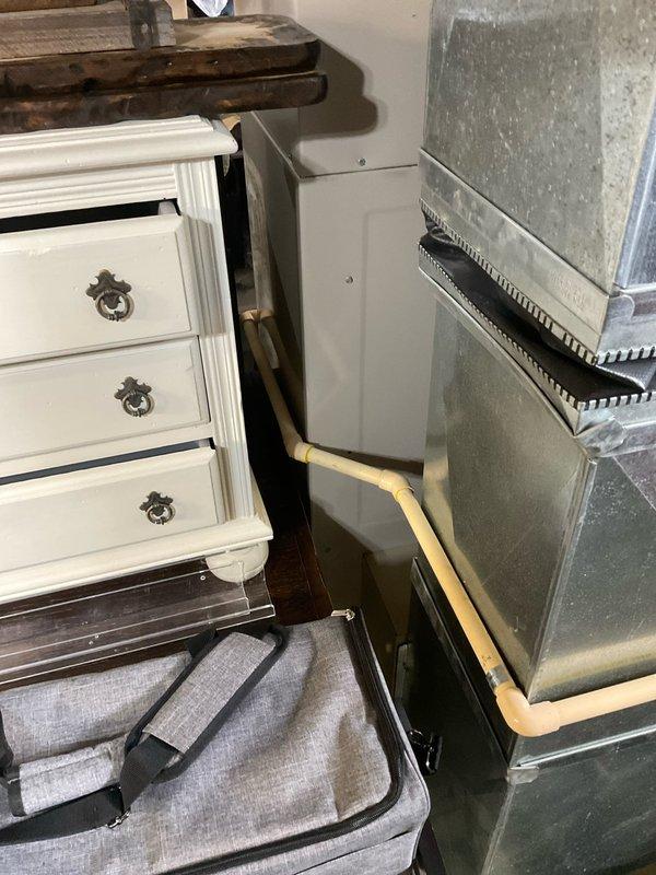 Performed on-site assessment of 2003 Lennox Elite Series furnace with failed heat exchanger. Documented existing equipment condition and installation configuration, including PVC venting system and ductwork connections. Prepared comprehensive replacement estimate for single component furnace upgrade to address heat exchanger failure and restore heating system functionality.