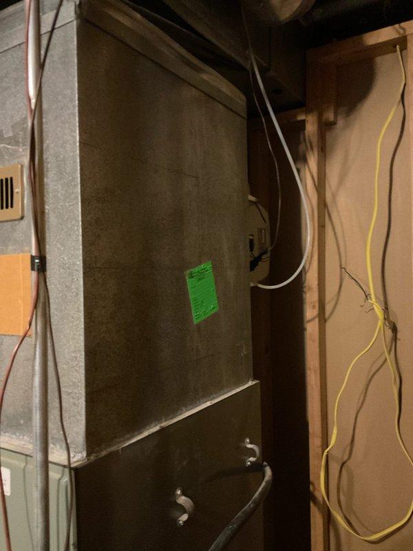 Completed comprehensive assessment of existing HVAC system including furnace and air handler unit for replacement estimate. Documented current equipment configuration, refrigerant line connections, electrical wiring, ductwork layout, and installation conditions in unfinished basement utility area. Generated replacement quote for customer review, with additional quote pending availability.