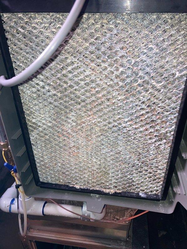 Completed annual HVAC maintenance and AC tune-up as part of prepaid membership agreement. Inspected air conditioning system, replaced heavily soiled air filter that showed significant dust and debris accumulation, and tested 40-amp fuses in outdoor disconnect box to verify proper electrical protection and system safety.