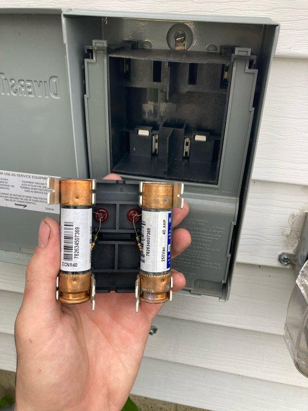 Completed annual HVAC maintenance and AC tune-up as part of prepaid membership agreement. Inspected air conditioning system, replaced heavily soiled air filter that showed significant dust and debris accumulation, and tested 40-amp fuses in outdoor disconnect box to verify proper electrical protection and system safety.