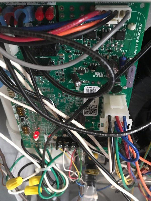 Completed preventive maintenance agreement visit on air conditioning system. Performed comprehensive inspection of blower motor assembly and control board components, documenting equipment condition with photos. Blower wheel showed dust accumulation on blades; motor assembly and White-Rodgers control board with all electrical connections operating within normal parameters at time of inspection.