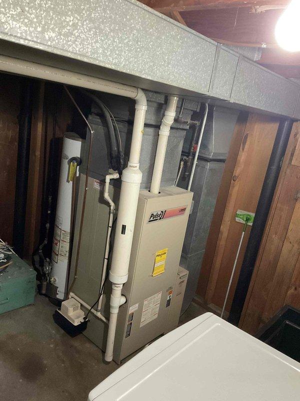 Completed comprehensive estimate for replacement of existing outdoor air conditioning condensing unit and indoor furnace system. Evaluated current equipment condition, noting weathered outdoor unit with aging components and existing basement furnace installation, documented electrical disconnect configuration and venting systems, assessed installation site conditions including concrete pad placement and clearances, and provided detailed replacement recommendations for complete HVAC system upgrade.