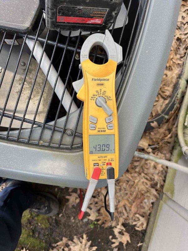 Completed scheduled air conditioning maintenance agreement visit on residential cooling system. Performed comprehensive AC tune-up including electrical diagnostics using clamp meter to measure amp draw and system performance parameters. Inspected outdoor condensing unit, verified proper operation of all components, and documented system readings for maintenance records.