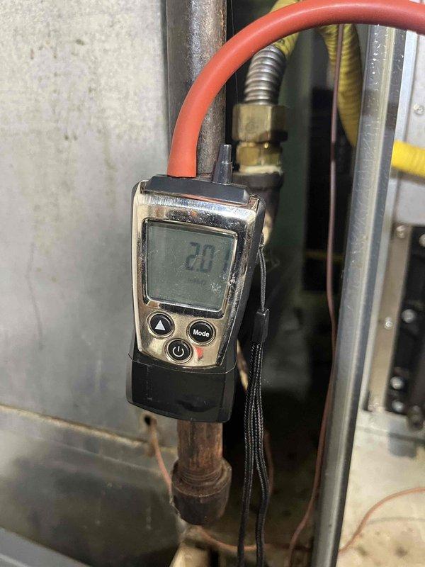 Completed routine maintenance inspection on HVAC system under Club Heat and AC8-12 agreement. Performed comprehensive air handler and system inspection, documenting equipment condition with diagnostic measurements showing system operating at 20 degrees temperature differential. Verified blower motor operation, inspected electrical connections including multiple wire harnesses, and examined all refrigerant line connections and brass fittings for proper installation and integrity. All components found operating within normal parameters with no immediate service needs identified.