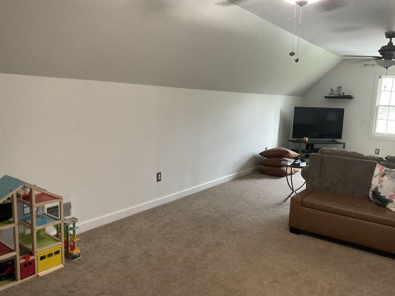 Conducted mini split system estimate for bonus room with vaulted ceiling and carpeted flooring. Assessed space requirements, electrical outlet locations, and optimal placement for indoor air handler unit to provide climate control for the upper-level living area. Documented room configuration and captured photos for equipment sizing and installation planning.