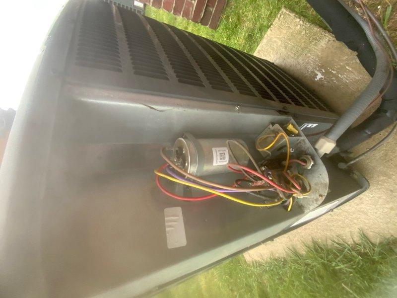 Responded to no cooling call on 10+ year old air conditioning system. Upon arrival, found unit completely inoperative with no power to outdoor condensing unit. Removed access panel and inspected internal components including compressor, capacitor, and electrical connections. Diagnosed failed dual run capacitor preventing compressor and condenser fan motor from starting. Replaced defective capacitor with properly rated replacement, verified all electrical connections were secure, and tested system operation. Unit successfully restored to normal cooling operation with proper amperage draw on both compressor and fan motor circuits.