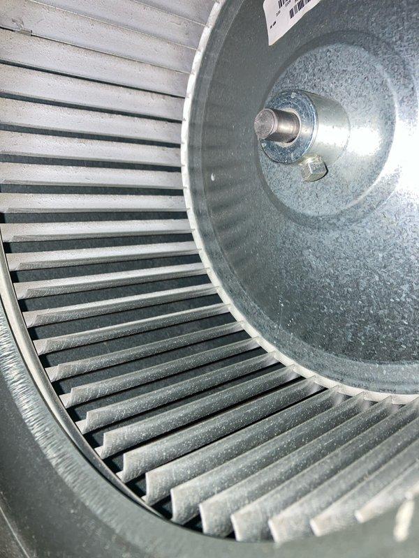 Completed annual AC maintenance tune-up as part of prepaid membership agreement. Performed comprehensive system inspection including blower wheel assembly evaluation, noting normal operational dust accumulation on squirrel cage fan blades and housing. Tested capacitor with digital multimeter to verify proper electrical performance and system functionality, confirming all readings within acceptable parameters for continued reliable operation.