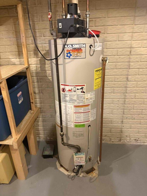 Completed full HVAC system installation including a 90,000 BTU furnace and 4-ton air conditioning unit positioned on the right side of the property. Installation included all mechanical and electrical connections, integration of a whole-home humidifier, and reconnection of existing ductwork and utilities. System was evacuated to proper vacuum levels as verified by digital micron gauge readings, ensuring leak-free refrigerant lines and optimal performance of the new air conditioning system.
