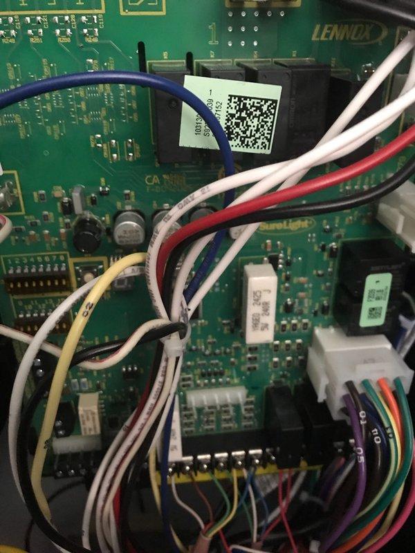 Completed annual AC maintenance and tune-up on Lennox system. Inspected and photographed control board with all wire harnesses properly connected and operational. Verified ductwork components and internal assembly in good working condition with no issues found.