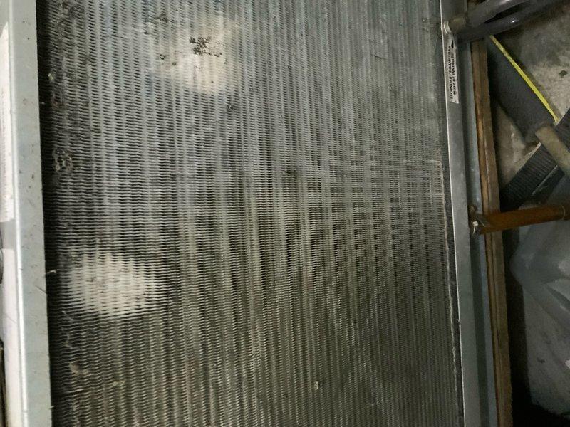 Responded to no cooling complaint at condominium unit. Upon arrival, performed system inspection and found evaporator coil heavily soiled with dirt and debris accumulation, restricting airflow and reducing heat transfer efficiency. Documented coil condition showing significant contamination across fin surfaces. The restricted airflow from the dirty coil was causing inadequate cooling performance. Recommended thorough coil cleaning and system evaluation to restore proper operation.