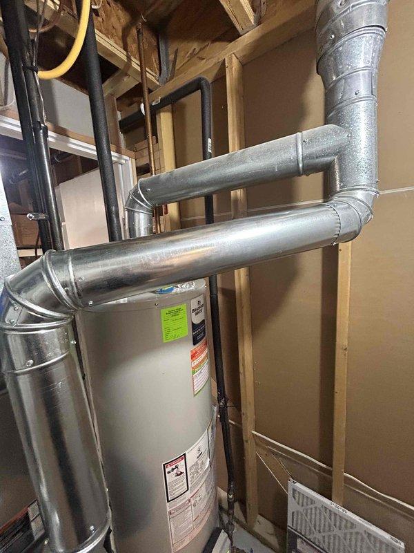 Completed full furnace installation including a 70,000 BTU unit with all necessary mechanical and electrical connections in utility closet. Installed and connected ductwork system with metallic and flexible ducts, reconnected all components to existing HVAC infrastructure, and verified proper operation of heating system alongside existing water heater in compact mechanical space.