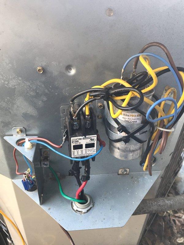 Responded to no cooling complaint at residential property. Upon inspection, found failed dual run capacitor preventing compressor and condenser fan motor operation. Replaced defective TRADEPRO capacitor with new TITAN PRO TRCD-455 rated capacitor, verified proper microfarad ratings for both compressor and fan circuits, secured all electrical connections, and tested system operation to confirm cooling restored.