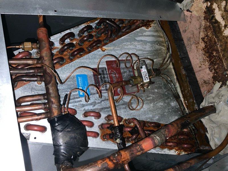 Responded to callback for recently installed AC unit not cooling adequately. Confirmed original diagnosis of failed compressor and inspected system for refrigerant leaks. Leveled outdoor condenser unit with pea gravel to ensure proper operation and drainage. Documented system condition including dirty condenser coil fins with debris accumulation and inspected refrigerant lines, electrical components, and control modules for proper installation and function.