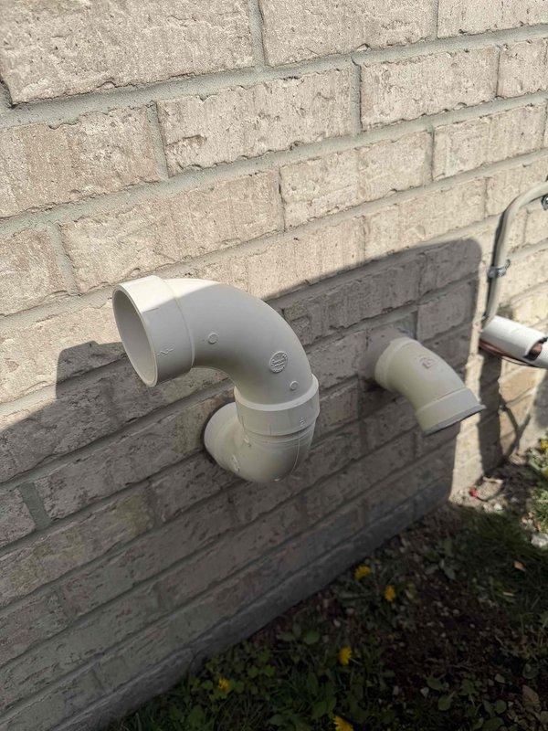 Completed full HVAC system installation including a 70,000 BTU furnace, 2.5 ton air conditioning unit, and humidifier with all components positioned in the rear yard area. Successfully reconnected all necessary utilities, installed proper venting through exterior wall using white PVC exhaust piping, and ensured all mechanical connections met code requirements for safe and efficient operation.