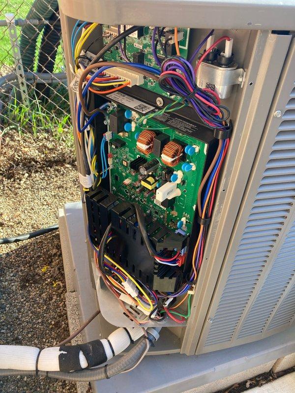 Completed prepaid HVAC maintenance tune-up on residential air conditioning system. Performed comprehensive inspection of outdoor condensing unit, including examination of fan assembly, control board, electrical connections, and capacitor. Verified proper operation of dual toroidal inductors on control board and inspected all wire terminations for secure connections. Assessed fan blade condition and motor assembly, noting minor dust accumulation consistent with normal operation. Confirmed condensate drainage system and refrigerant line connections are secure and properly routed. All electrical components, including capacitor and control circuitry, tested within normal operating parameters. System operational and ready for cooling season.