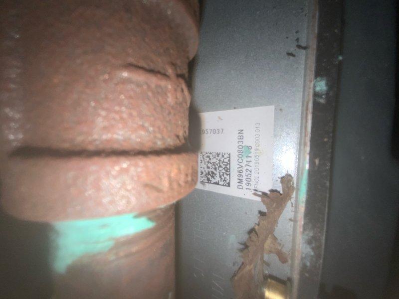 Responded to no-cool call on 6-year-old Daikin central air conditioning system. Upon inspection, found outdoor unit not operating and confirmed condensate drainage issues in basement air handler. Discovered clogged condensate drain line with significant biological growth and mineral deposits restricting flow, causing water backup at evaporator coil drain pan. Cleared condensate line obstruction using mechanical methods and verified proper drainage. Inspected evaporator coil and drain pan, noting rust staining and deterioration consistent with previous overflow conditions. Tested system operation and confirmed outdoor unit now engaging properly, achieving normal cooling cycle. Advised ongoing maintenance of condensate system to prevent future blockages.