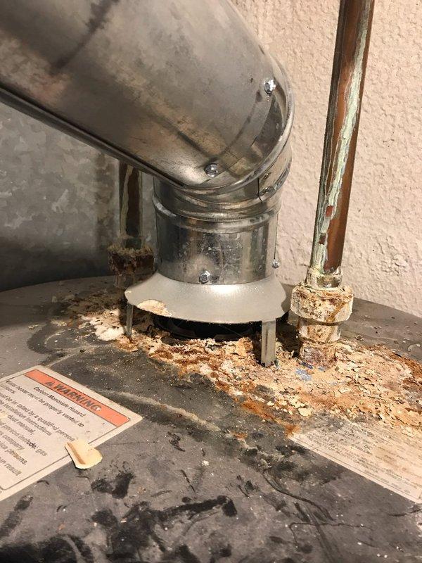 Responded to no heat call on 5-year-old furnace system. Upon arrival, performed diagnostic inspection of heating equipment and associated components. Visual inspection revealed significant rust and corrosion at the furnace vent pipe connection point, with extensive deterioration around the base and flue elbow joint. The corrosion had compromised the integrity of the venting system, creating a potential safety hazard and contributing to improper system operation. 

Evaluated the Honeywell heating unit and verified thermostat operation. Documented the condition of the corroded vent pipe assembly and surrounding areas with photographs for service records. The rust accumulation and degraded gasket at the connection point indicated moisture infiltration and possible condensation issues affecting the venting system. Advised that the deteriorated vent pipe components require replacement to restore safe and proper furnace operation. System was left in safe condition pending necessary repairs t