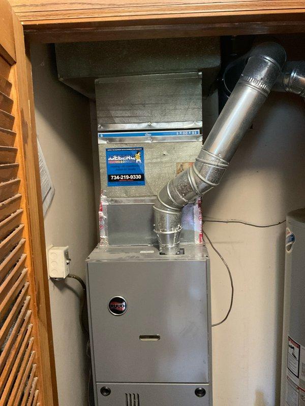 Responded to service call for AC inspection due to whining noise upon startup and thermostat replacement request. Performed comprehensive system evaluation of Rheem/Ruud HVAC system including air handler and furnace unit. Inspected ductwork connections, electrical components, and mechanical components for source of noise concern. System confirmed operational for both heating and cooling functions. Documented equipment condition with photographs showing furnace, air handler, and ductwork configuration in utility closet installation. Provided recommendations for smart thermostat installation compatibility and addressed noise diagnostic findings with homeowner.