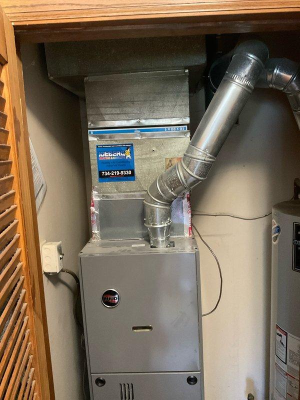Responded to service call for AC inspection due to whining noise upon startup and thermostat replacement request. Performed comprehensive system evaluation of Rheem/Ruud HVAC system including air handler and furnace unit. Inspected ductwork connections, electrical components, and mechanical components for source of noise concern. System confirmed operational for both heating and cooling functions. Documented equipment condition with photographs showing furnace, air handler, and ductwork configuration in utility closet installation. Provided recommendations for smart thermostat installation compatibility and addressed noise diagnostic findings with homeowner.