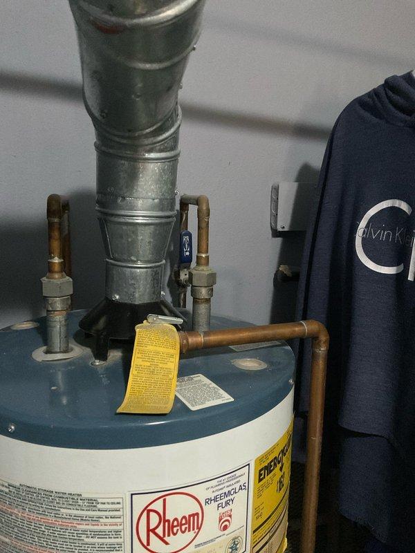 Conducted comprehensive water heater assessment and provided detailed estimate for replacement of existing Rheem unit. Evaluated current installation including all copper supply line connections, shut-off valves, brass fittings, and metallic flue venting system. Documented existing equipment condition, plumbing configuration, and utility room layout to prepare accurate replacement specifications and scope of work.