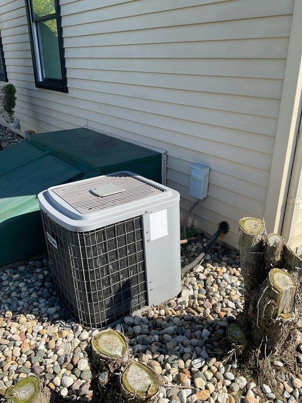 Conducted comprehensive site evaluation for complete HVAC system replacement. Assessed existing outdoor condensing unit positioned on decorative stone bed against exterior wall and indoor furnace installation in basement utility area with exposed framing. Documented current equipment configuration, electrical connections, ductwork routing through ceiling joists, and clearance requirements for replacement unit specifications. Provided detailed estimate for new system installation including equipment removal, proper sizing recommendations, and installation requirements based on existing infrastructure and space constraints.