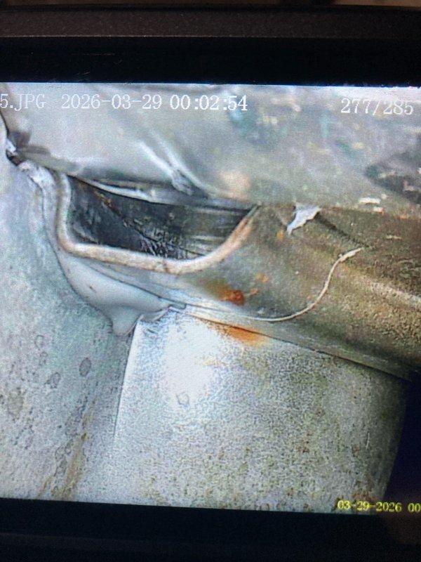 Responded to maintenance call for air conditioning system not cooling. Upon inspection, discovered severe corrosion and deterioration within the heat exchanger, exhibiting extensive rust patterns and water damage indicating prolonged moisture exposure. Documented compromised ductwork in crawl space showing significant corrosion, torn insulation, and deteriorated protective coating. System deemed unsafe for operation due to heat exchanger failure presenting potential carbon monoxide hazard. Recommended immediate system replacement and advised customer to discontinue use until new unit installed.