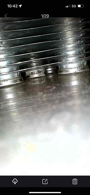 Completed comprehensive heating and cooling system tune-up on residential HVAC unit. Inspected evaporator coil assembly, noting normal condensation patterns and minor surface discoloration on fins. Examined ductwork system, observing typical wear and minor moisture accumulation on flexible ducting. System operating within normal parameters with no immediate service needs identified.