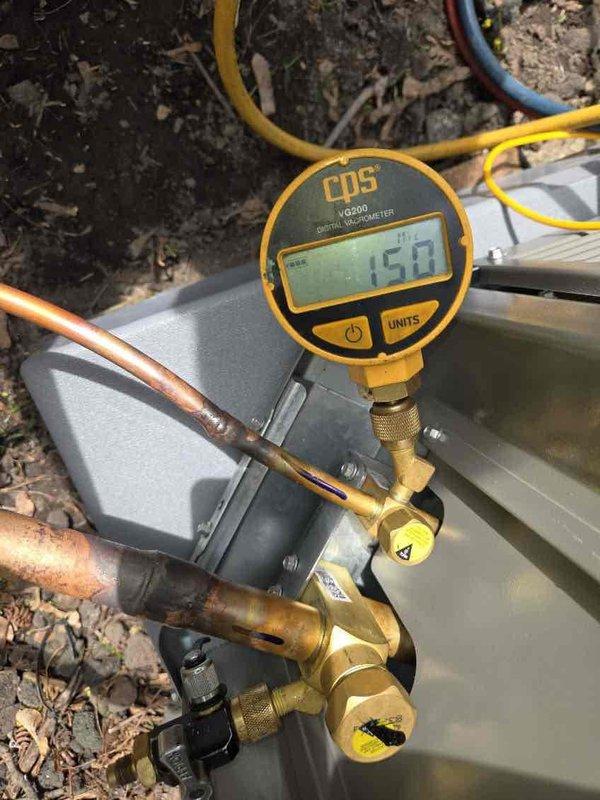 Completed installation of 3-ton air conditioning system with matching evaporator coil at rear location of residence. Installation included all necessary mechanical connections, electrical wiring, refrigerant line sets with proper insulation, condensate drainage via PVC piping to approved discharge point, and service valve configuration. System was evacuated to proper micron level as verified by digital vacuum gauge reading of 150 microns, charged with manufacturer-specified refrigerant quantity, and tested for proper operation. All connections secured and system operational upon completion.