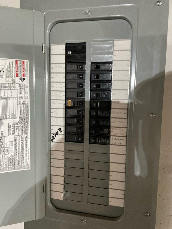 Conducted on-site evaluation and generated comprehensive estimate for whole home generator installation. Documented existing electrical infrastructure including main service panel with Square D breaker box, assessed current circuit breaker configuration and available capacity for generator integration. Photographed electrical panel interior showing dual columns of circuit breakers, existing branch circuit wiring, and service entrance conductors to determine compatibility requirements for automatic transfer switch installation and proper load calculation for generator sizing.