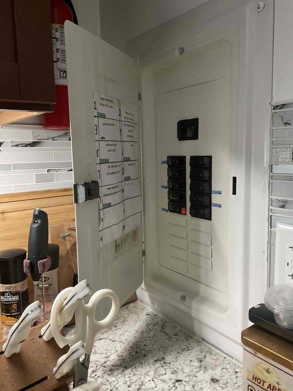 Conducted site evaluation for new mini split system installation at owner-occupied single family residence. Assessed existing electrical infrastructure by inspecting main service panel to verify capacity and available breaker spaces for mini split power requirements. Documented electrical panel configuration and circuit layout to determine feasibility of installation and identify optimal connection point for new HVAC equipment.