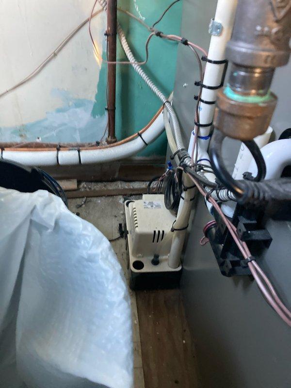 Completed routine preventive maintenance visit for club AC and heating system. Inspected and photographed condensate pump assembly, drainage lines, and associated plumbing connections in mechanical utility area to verify proper operation and secure mounting. Removed, inspected, and replaced air filter to maintain optimal airflow and system efficiency.