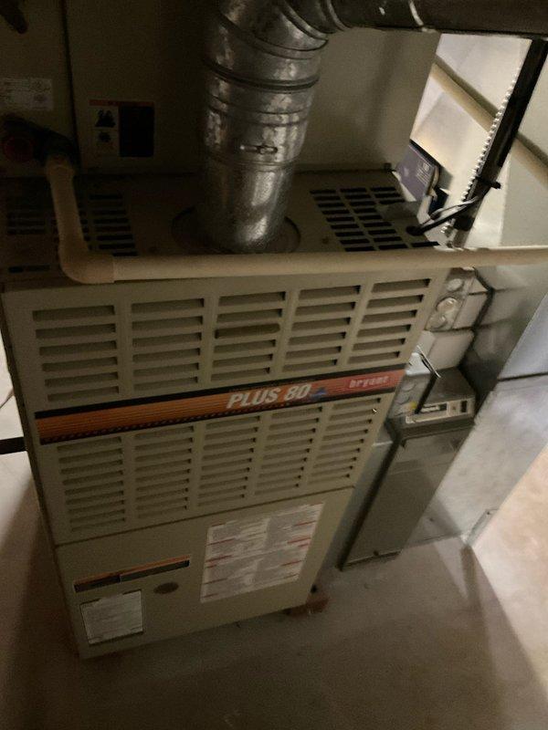 Conducted on-site evaluation of aging HVAC system including furnace and air conditioning components. The existing Plus 80 furnace and AC unit showed signs of advanced wear, with the air conditioning system producing abnormal operational noises indicating potential compressor or fan motor issues. Performed comprehensive assessment of both heating and cooling equipment, documented current system configuration including ductwork connections and humidifier integration, and photographed equipment for replacement estimate preparation. Provided detailed replacement options for complete HVAC system upgrade to prevent imminent failure.