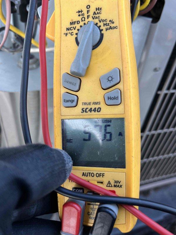 Completed Club AC8-12 maintenance agreement visit and addressed customer inquiry regarding ductwork fan installation. Performed standard system diagnostics on outdoor condensing unit, measuring compressor amperage at 39.10 amps and fan motor current at 5.6 amps, with all electrical readings within manufacturer specifications. Provided technical consultation on inline duct fan options and proper installation requirements for improved airflow distribution throughout the system.