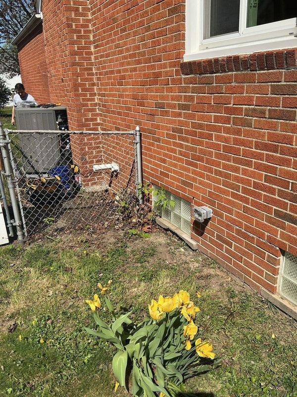 Installed ground fault circuit interrupter (GFI) outlet at exterior location on brick foundation wall near HVAC condenser unit. Ensured proper weatherproof enclosure and verified correct wiring connections for outdoor electrical safety compliance.