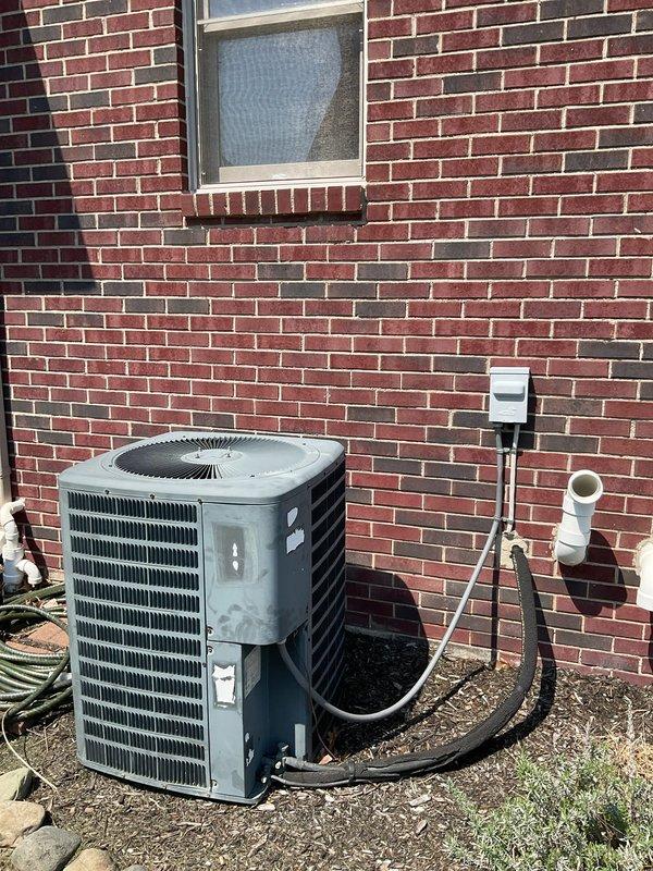 Conducted comprehensive on-site evaluation of existing 20+ year-old residential HVAC system with failed AC compressor. Assessed outdoor condenser unit condition, refrigerant line configuration, electrical disconnect setup, and indoor air handler with ductwork and condensate drainage system. Documented equipment specifications, installation layout, and system components to prepare detailed replacement estimate for complete HVAC system upgrade.