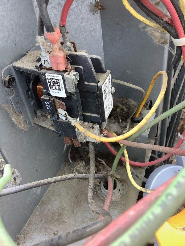 Responded to service call for air conditioning unit running loud and not operating properly. Upon inspection, found faulty contactor with signs of wear and pitting on contact points causing excessive noise and intermittent operation. Replaced defective contactor and verified proper amperage draw of 61.1 amps during system operation. Tested all electrical connections, confirmed proper voltage supply, and verified unit is now operating quietly with normal cooling cycle.