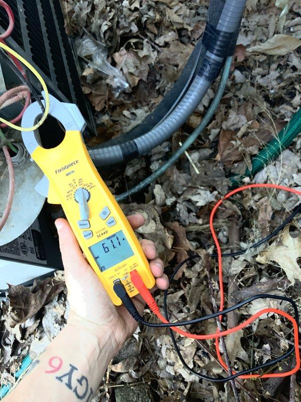 Responded to service call for air conditioning unit running loud and not operating properly. Upon inspection, found faulty contactor with signs of wear and pitting on contact points causing excessive noise and intermittent operation. Replaced defective contactor and verified proper amperage draw of 61.1 amps during system operation. Tested all electrical connections, confirmed proper voltage supply, and verified unit is now operating quietly with normal cooling cycle.