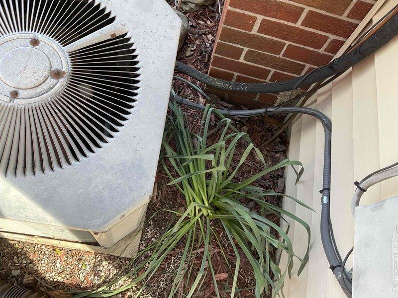 Completed comprehensive HVAC system replacement estimate for residential property. Evaluated existing outdoor condensing unit positioned on concrete pad adjacent to brick exterior wall with refrigerant lines running along vinyl siding. Assessment included multiple equipment configuration options to provide customer with appropriate capacity and efficiency selections for their cooling needs.