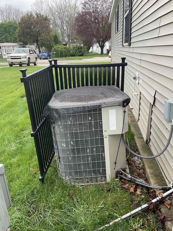 Provided comprehensive estimate for complete HVAC system replacement including both furnace and air conditioning condenser unit, both original equipment dating from 2007. Assessed existing outdoor condensing unit positioned against exterior wall with protective fencing and evaluated current refrigerant line set configuration. Documented equipment specifications and existing installation conditions to prepare detailed replacement proposal for aging residential heating and cooling system.