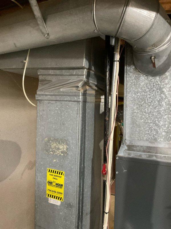 Performed diagnostic evaluation on 16-year-old HVAC system and discovered condenser unit completely void of refrigerant, indicating significant system failure. Provided comprehensive estimate options comparing repair versus full system replacement, explaining that repair would require refrigerant recharge and extensive leak detection process with no guarantee of successful repair due to age and condition of equipment. Recommended complete system replacement as most cost-effective solution given the unit's age and potential for additional component failures. Documented existing furnace and air handler configuration with connected ductwork and PVC condensate piping for replacement specifications.