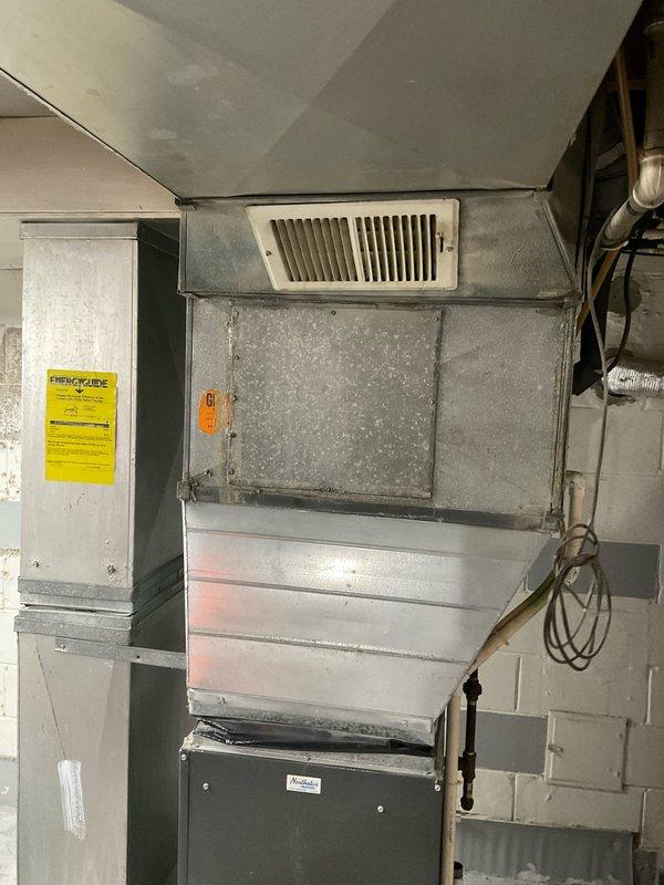 Conducted comprehensive site assessment for HVAC system replacement in basement utility area. Evaluated existing air handler installation, electrical panel capacity with dual-column breaker configuration, and spatial constraints preventing air conditioning unit relocation. Documented current equipment condition including metallic air handler with plenum assembly, ductwork connections, and electrical service requirements. Prepared detailed replacement estimate with multiple quote options for customer review.