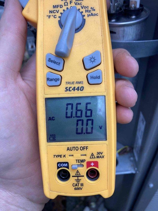 Completed routine HVAC maintenance agreement visit including air conditioning and system inspection. Verified Honeywell Home HumidiPRO humidistat operation showing 48% indoor humidity with system in off mode and light function active. Performed electrical diagnostics using digital multimeter, recording 0.66 AC voltage readings to confirm proper system operation and control circuit functionality.