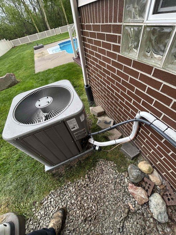 Completed callback service to relocate AC condenser unit away from generator to ensure proper clearances and code compliance. Installed additional lineset to accommodate new equipment position, secured unit on fresh pea gravel base, and verified all refrigerant connections and condensate drainage lines are functioning properly per manufacturer specifications.