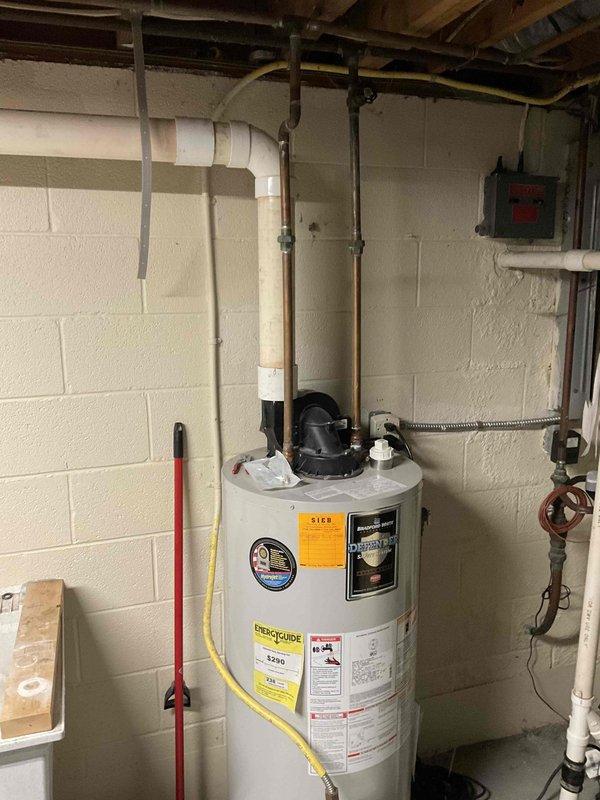 Completed comprehensive water heater replacement estimate for residential property. Assessed existing water heater installation including all supply and discharge plumbing connections, electrical panel capacity for new unit requirements, and proper venting configuration. Documented current system specifications, measured available clearances in mechanical room, and photographed electrical distribution panel to verify adequate circuit availability for replacement unit installation.