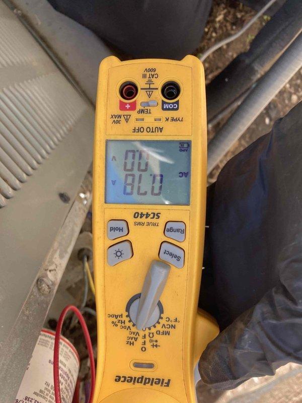 Performed comprehensive 10-point air conditioning tune-up including system diagnostics and performance verification. Inspected blower wheel assembly and confirmed proper operation with clean blade configuration and secure mounting hardware. Conducted electrical testing using digital multimeter to verify proper voltage and system functionality, with all readings within manufacturer specifications.