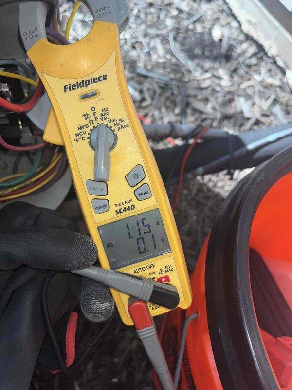 Completed routine furnace and air conditioning maintenance club visit, performing comprehensive system diagnostics on both heating and cooling equipment. Used digital clamp meter to verify electrical current readings on the Lennox outdoor condensing unit, measuring amperage at 15.88 amps on one component and 1.15 amps on another circuit, confirming proper electrical operation within manufacturer specifications. Inspected condenser coils, fan motor operation, and overall unit condition. Tested indoor heating system components, checking electrical connections and verifying proper amperage draws on furnace circuits. All systems operating correctly with no deficiencies noted. Both heating and cooling equipment passed inspection and are functioning as designed for the seasonal maintenance agreement visit.