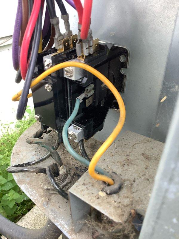 # AC Not Turning On - Unit 10+ Years Old

Responded to no cooling call on aging air conditioning system. Upon arrival, confirmed outdoor condensing unit was not energizing when thermostat called for cooling. Performed visual inspection of outdoor unit electrical components and identified failed contactor as primary issue.

The contactor showed significant wear consistent with age and extended service life, with visible pitting and corrosion on contact points preventing proper electrical connection. Removed failed contactor and installed new replacement unit, ensuring all wire connections were properly terminated and secured to manufacturer specifications. Verified all wire terminations were tight, including line voltage, load, and control circuit connections.

Restored power to system and cycled unit through multiple cooling cycles to confirm proper operation. Contactor engaged smoothly with audible click, and compressor and condenser fan motor energized as designed. Monitored system f