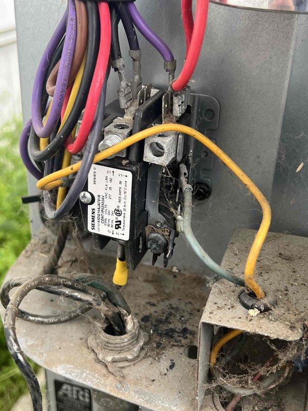 # AC Not Turning On - Unit 10+ Years Old

Responded to no cooling call on aging air conditioning system. Upon arrival, confirmed outdoor condensing unit was not energizing when thermostat called for cooling. Performed visual inspection of outdoor unit electrical components and identified failed contactor as primary issue.

The contactor showed significant wear consistent with age and extended service life, with visible pitting and corrosion on contact points preventing proper electrical connection. Removed failed contactor and installed new replacement unit, ensuring all wire connections were properly terminated and secured to manufacturer specifications. Verified all wire terminations were tight, including line voltage, load, and control circuit connections.

Restored power to system and cycled unit through multiple cooling cycles to confirm proper operation. Contactor engaged smoothly with audible click, and compressor and condenser fan motor energized as designed. Monitored system f