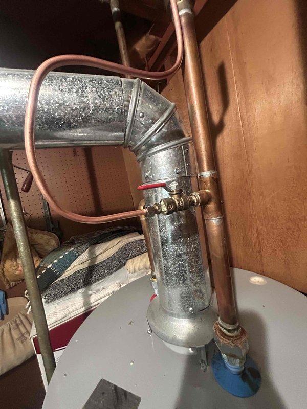 Completed installation of 3-ton air conditioning system with matching evaporator coil on existing furnace unit in basement utility area. Connected refrigerant lines, installed proper venting with PVC piping, and verified electrical connections to ensure system operates within manufacturer specifications. System tested and operational with appropriate condensation visible on ductwork, confirming proper cooling function.